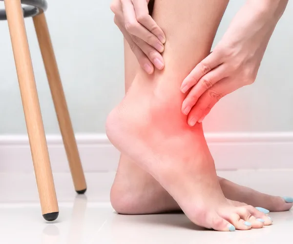 sharp pain on top of foot