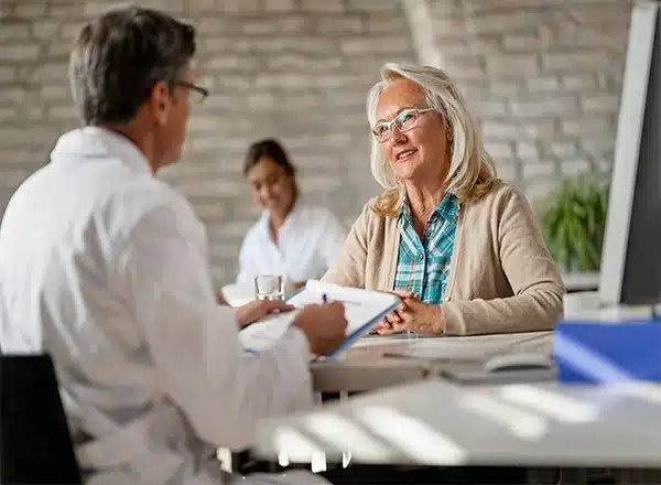 elderly woman checking for podiatrist insurance coverage