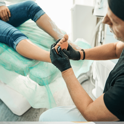 podiatrist with patient in clinic