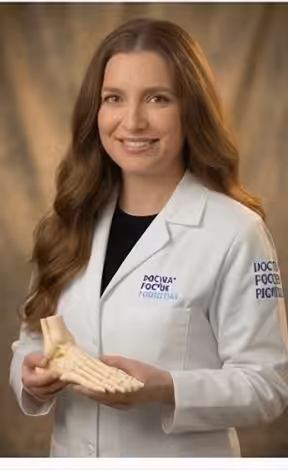 Dr. Daria Gutkin DPM Podiatrist White Coat Foot Bone Model Balance Foot Ankle