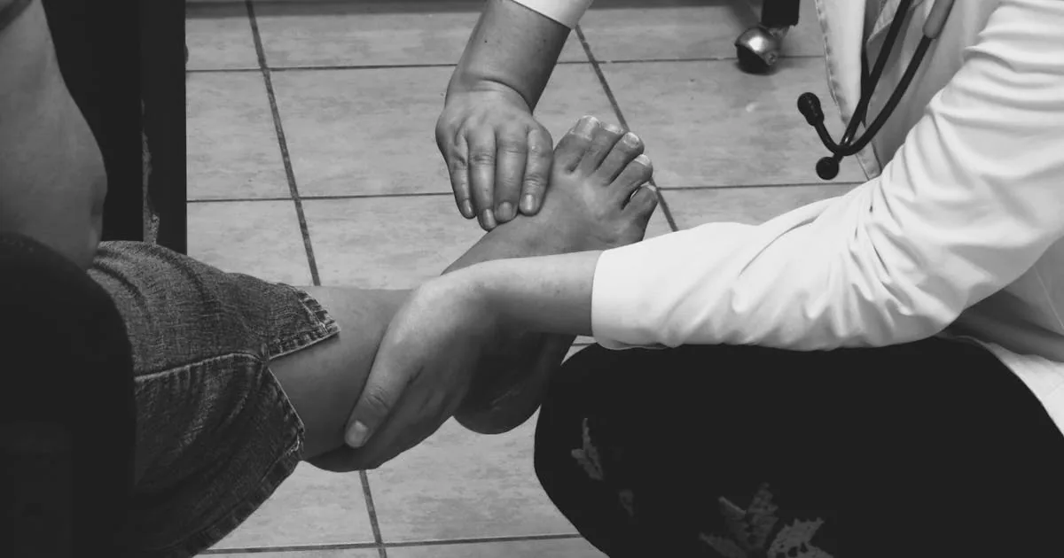 Doctor examining patient foot for diabetic neuropathy warning signs - Balance Foot & Ankle Howell MI