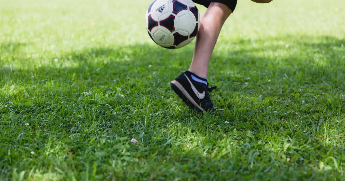 Child playing soccer — pediatric heel pain (Sever's disease), Balance Foot & Ankle, Howell MI
