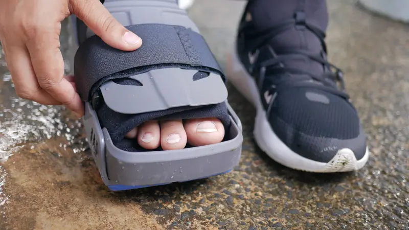 Foot in an orthopedic brace during ankle sprain recovery - Balance Foot & Ankle, Howell MI